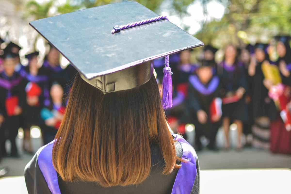 Graduate from behind with cap